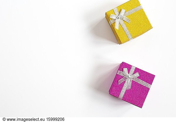 Sparkling gift box with ribbon bow purple and yellow isolated on White top view  space for text birthday concept.