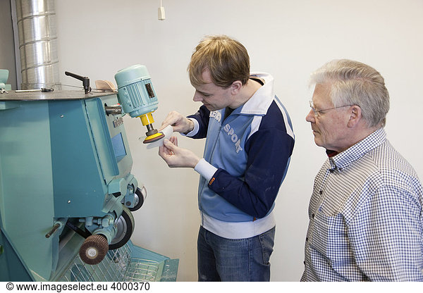 Specialist lecturer and Master Craftman student during the training using a grinder  Master course for orthopedic shoemakers  Master Craftman School of the Chamber of Small Industries and Skilled Trades  Dusseldorf  North Rhine-Westphalia  Germany  Europe