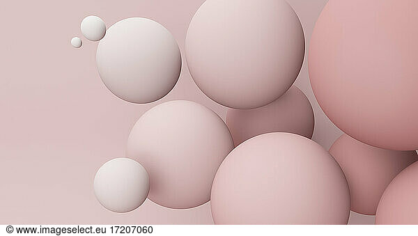 Spheres against pink background