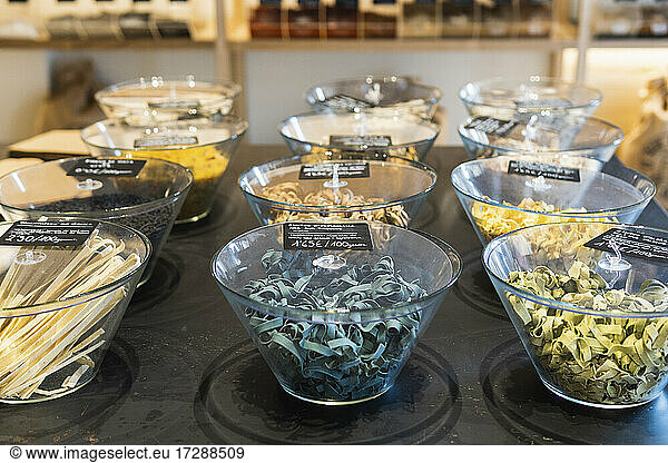 Spice bowls with price tag arranged on table in store