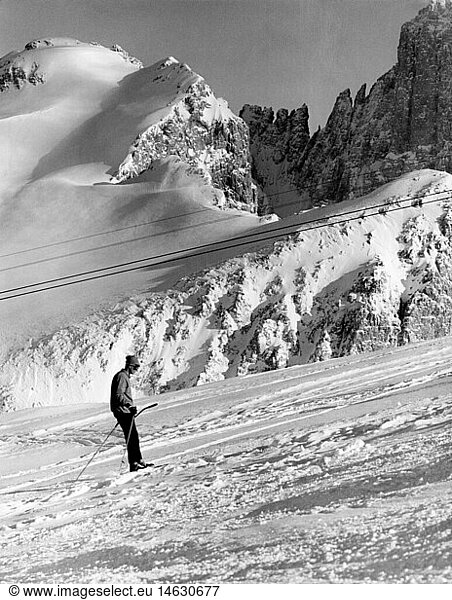 sports  winter sports  ski  lift  skiing man on rope  Cima Rosetta  Italy  1950s