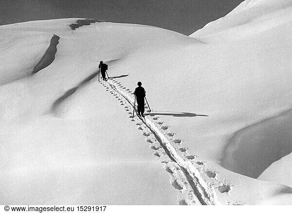 sports  winter sports  skiing  ski mountaineering  two skiers climbing mountain  Austria  1930s