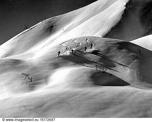 sports  winter sports  skiing  three skiers in the deep powder snow  Zuers  skiing area Arlberg  Vorarlberg  1960s