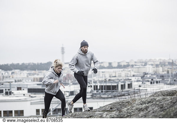 Sporty couple jogging together