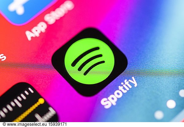 Spotify App  music streaming service  app icon  display on one screen of mobile phone  iPhone  iOS  smartphone  macro shot  detail  full format