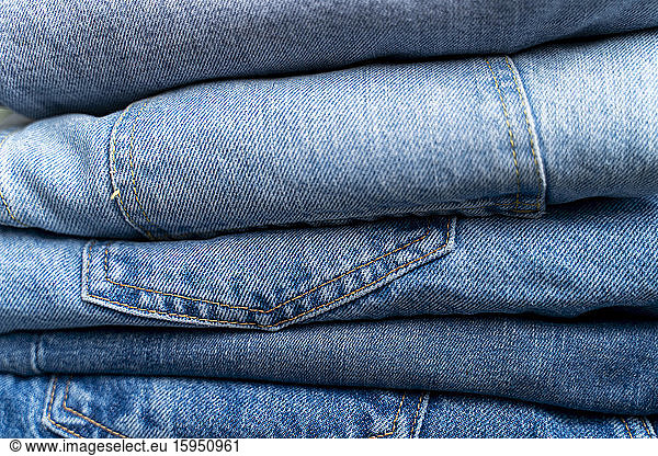 Stack of blue jeans  close-up