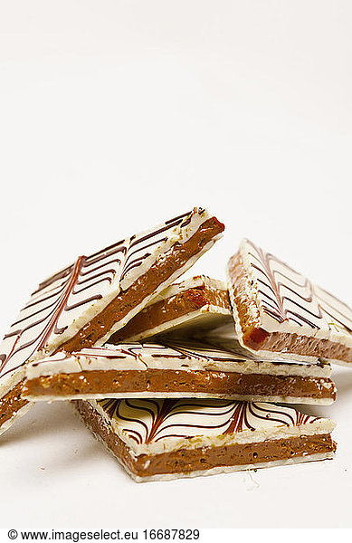 stack of caramel sweets on white background
