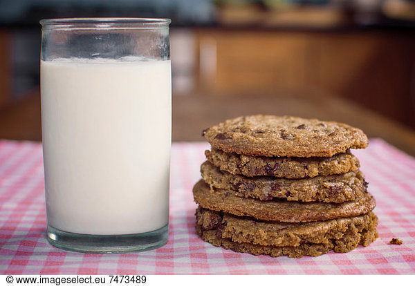 Stack of chocolate chip cookies and milk