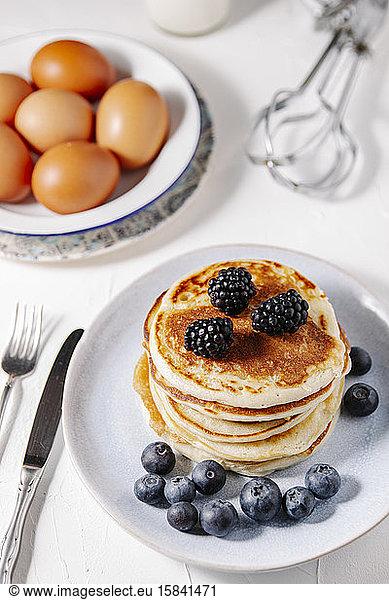 Stack of homemade pancakes bith berries