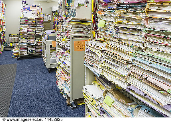 Stacks of papers and folders in library