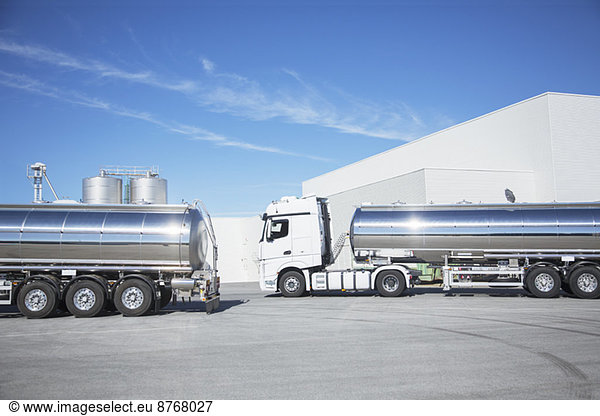 Stainless steel milk tankers parked