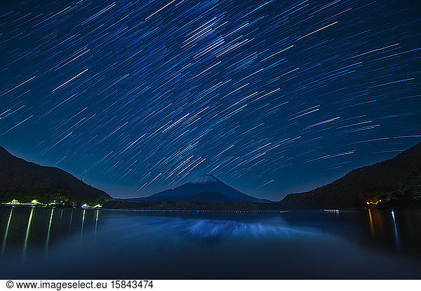 Star trails over Mount Fuji on a clear night from lake Shoji  Yamanashi Prefecture  Japan