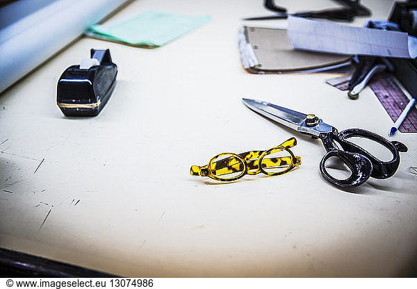 Stationery with eyeglasses on table at design studio