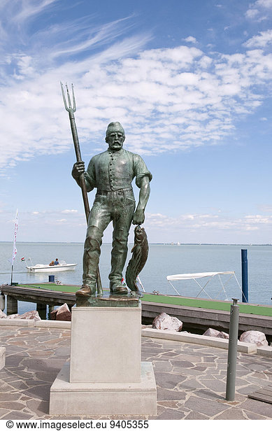 Statue of fisherman in Balatonfured harbour at Lake Balaton  Hungary