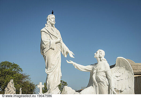 Statue of Jesus and an Angel in Cuban Cemetery