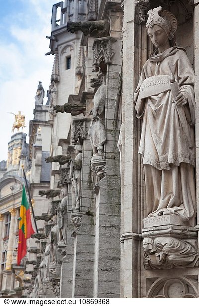 Statue on building in Grand Place  Brussels  Belgium
