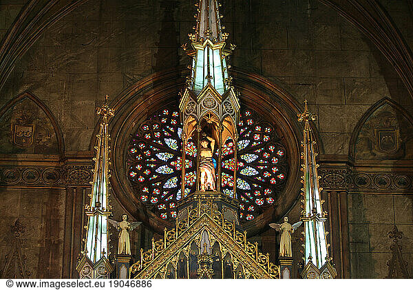 Statues and old painted glass window in San Sebastian Church  Manila  Philippines