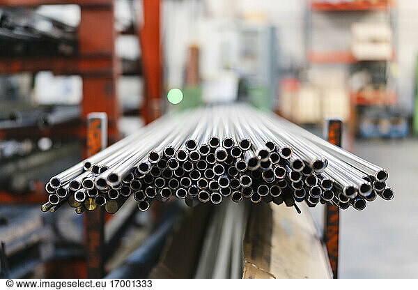 Steel pipes on shelf in factory