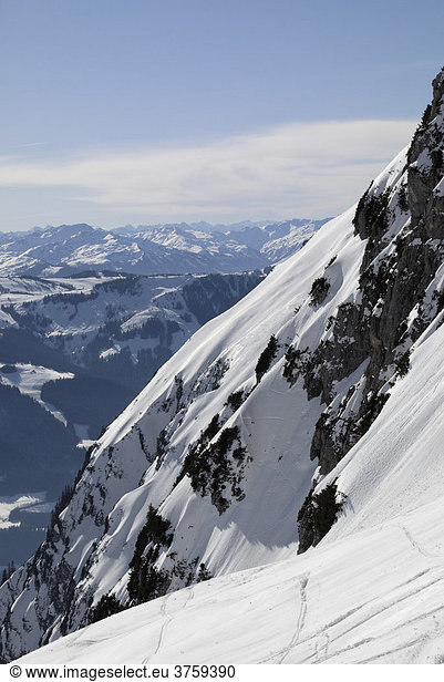 Steep snow-covered slope and Hohe Salve ski resort in the background Wilder Kaiser Range Tirol Austria Europe