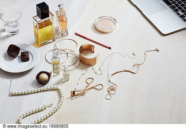 Still life with fashion accessories  computer  perfume