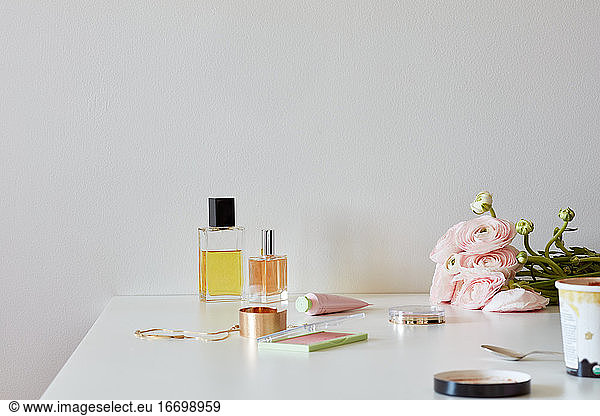 Still life with perfumes  powders  roses