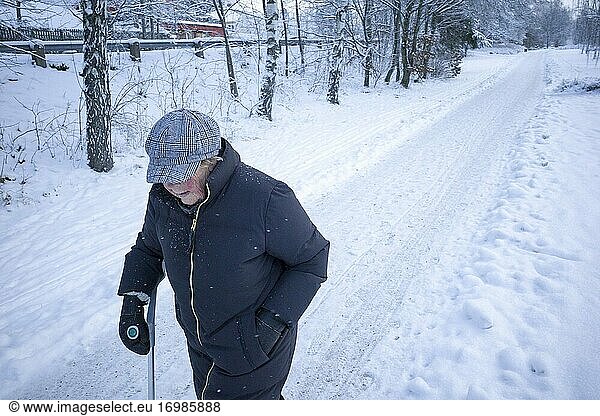 Stockholm  Sweden J An elderly woman walks alone on a snowy path.
