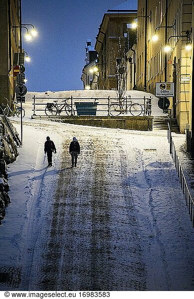 Stockholm  Sweden Pedestrians on Brannkyrkagatan in the snow in the early morning.
