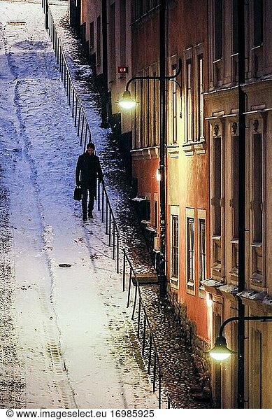 Stockholm  Sweden Pedestrians on Brannkyrkagatan in the snow in the early morning.