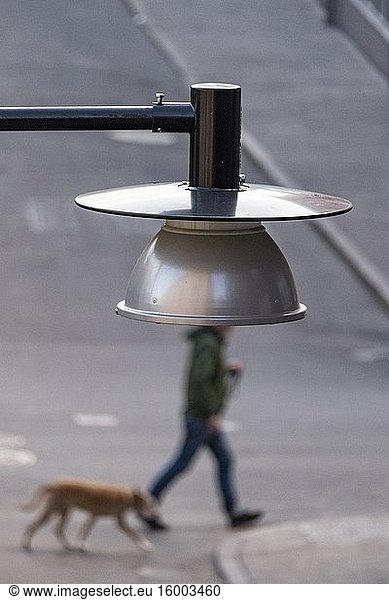 Stockholm  Sweden Pedestrians walking under a street lamp on Kapellgrand on Sodermalm.