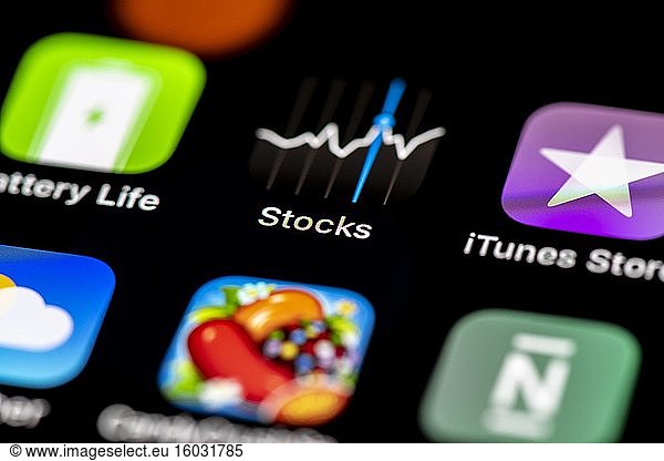 Stocks  App Icons on a mobile phone display  iPhone  Smartphone  close-up