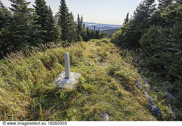 stone marker indicates international boundary between USA Canada