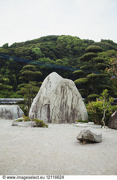 Stone rock in a Japanese Buddhist temple garden.