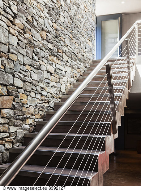 Stone wall and modern staircase
