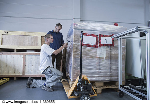 Store workers packaging in a distribution warehouse