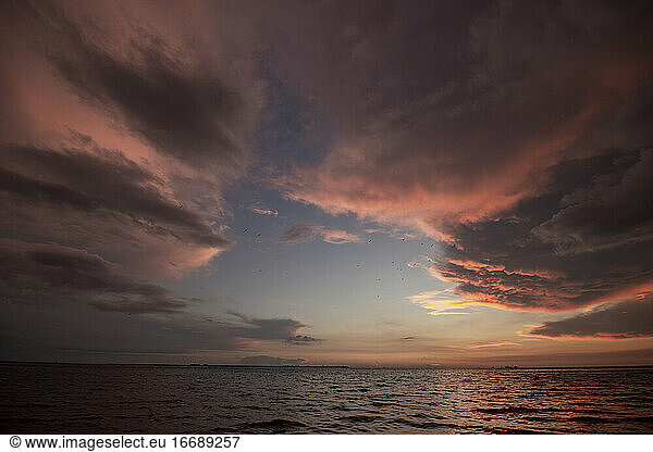 Storm Clouds and a Brilliant Sunset over Gulf in St. Petersburg  FL