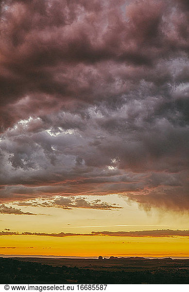 Storm clouds during sunset over desert landscape in Moab  Utah.