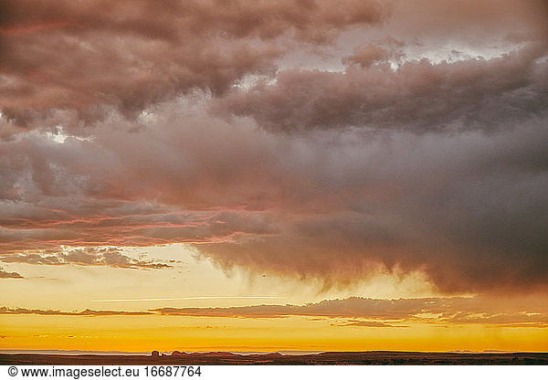 Storm clouds during sunset over desert landscape in Moab  Utah.