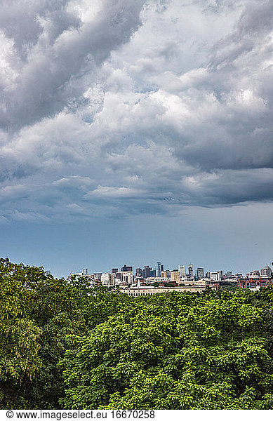 Storm clouds forming above city.