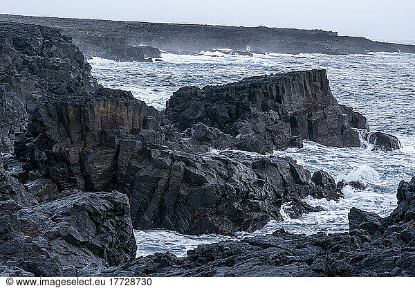 Storm waves hitting black basalt rock  Brimketill  Reykjanes peninsula  Iceland  Polar Regions