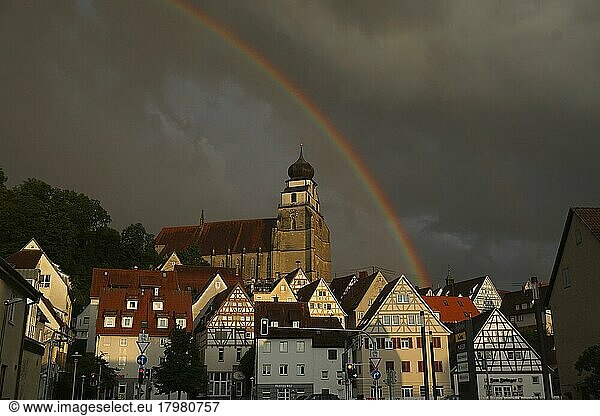 Stormy atmosphere with rainbow over collegiate church and old town  Herrenberg  Böblingen district  Baden-Württemberg  Germany  Europe