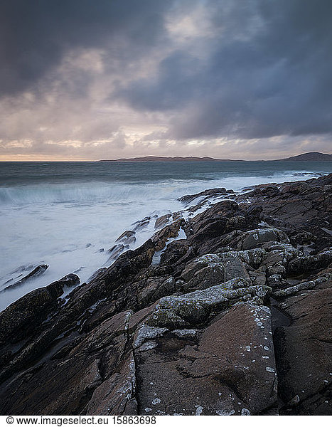 Stormy sea washes across rocky coastline  near Scarista  Isle of Harris  Scotland