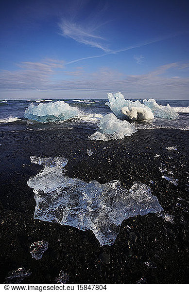 stranded icebergs on black sand beach in south east Iceland