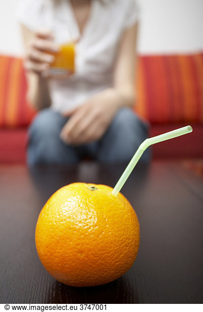 Straw in orange  pure orange juice.