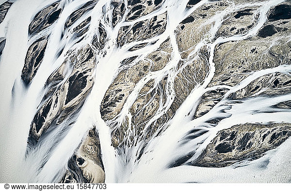 Streams of snow cutting through mountainous area