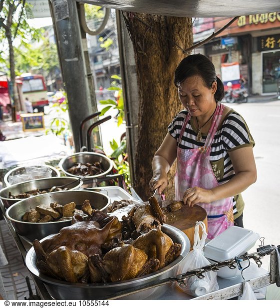 Street vendor preparing chicken at food stall  Chinatown  Bangkok  Thailand  Asia