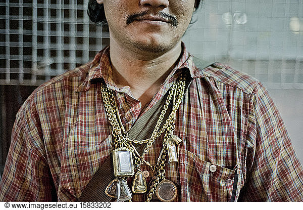 Street vendor with necklace religious jewelry