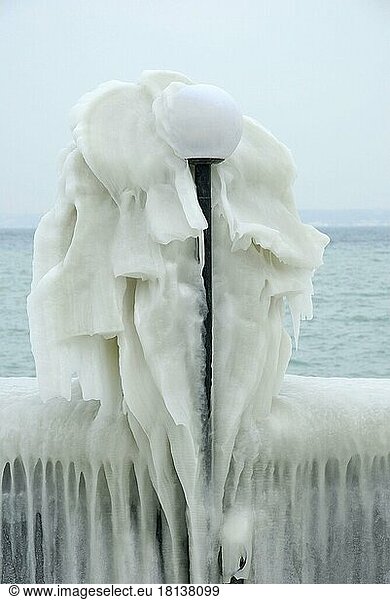 Streetlamp covered with ice  ice sculpture  Lake Geneva  Versoix  Canton Geneva  Switzerland  Europe