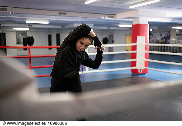 Strong fighter preparing for sparring on ring
