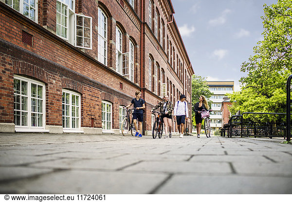 Students (14-15) walking by school