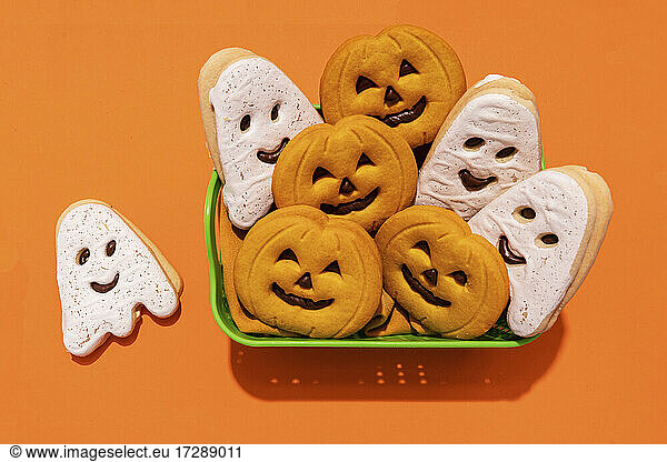 Studio shot of basket of Halloween themed cookies